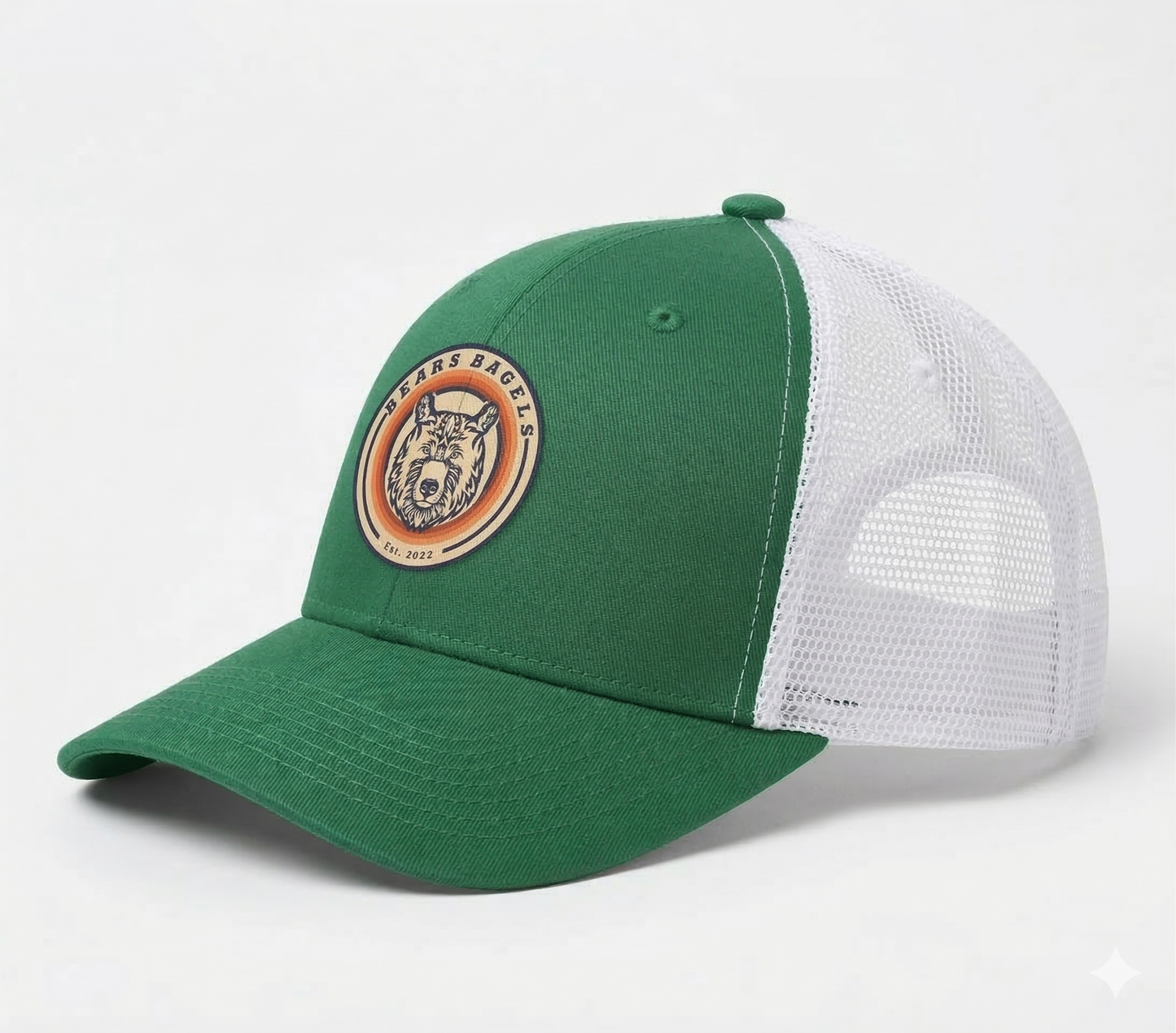Green and white cap with a logo on a light gray background